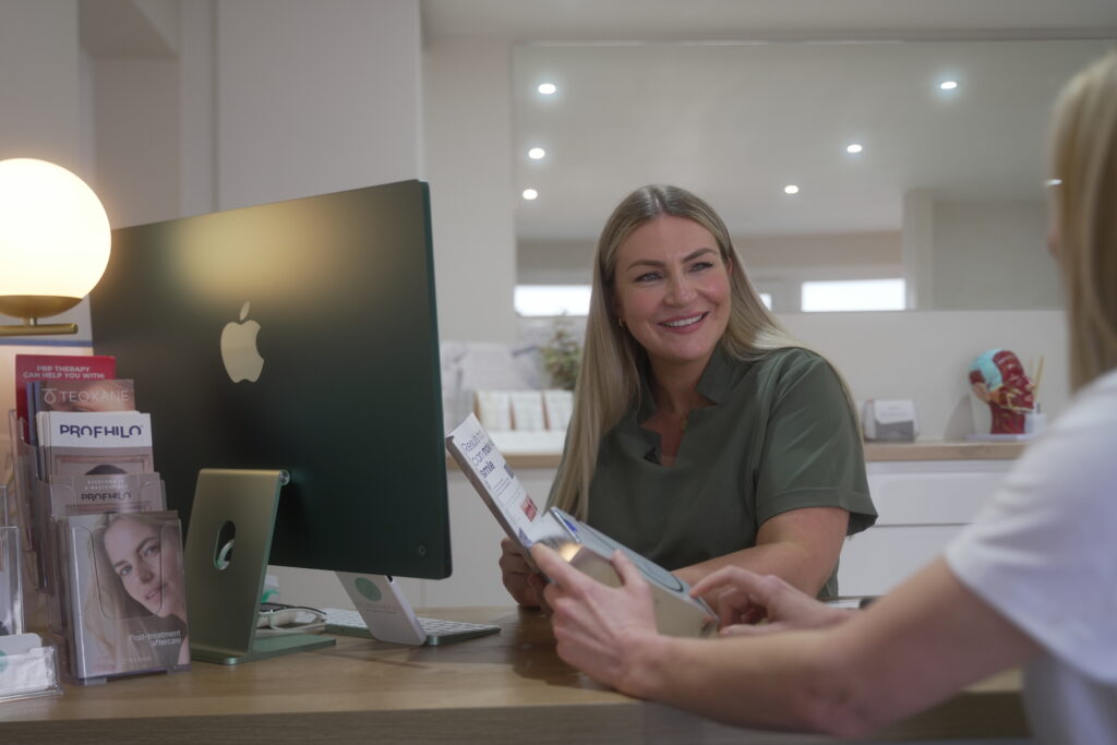 Aesthetic clinic reception booking more patients with healthcare SEO packages from Inject Digital